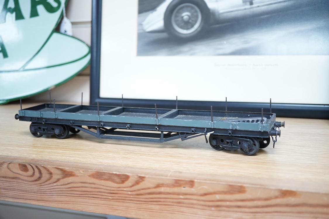 Eleven 0 gauge model railway items including; a bogie stake wagon, two mineral wagons, a North British coal wagon and two further open wagons, a partly constructed brake van, together with a Lima LMS 4F locomotive, two L